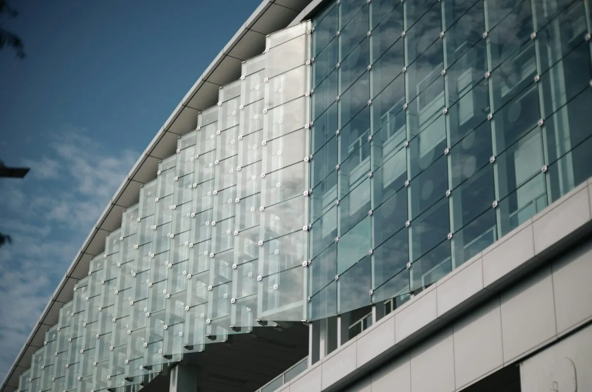 Curved glass and metal curtain wall facade