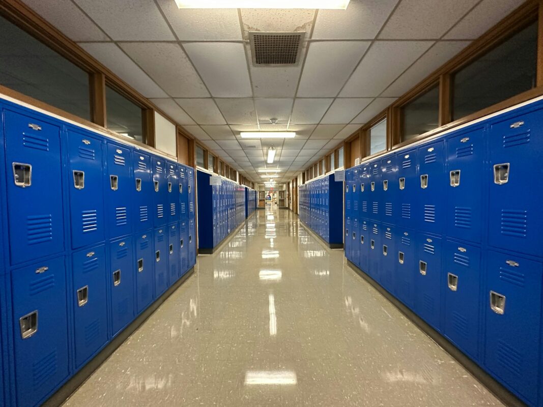 Rows of steel lockers in a corridor